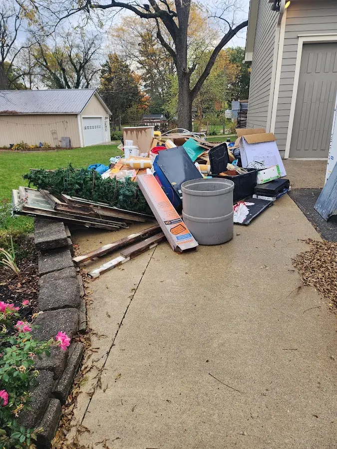Dumpster being loaded with debris for Estate Cleanout Dumpster Rental in Old Saybrook